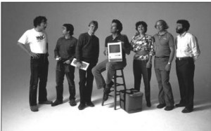 Much of the original Mac team: Bill Atkinson, Andy Hertzfeld, Chris Espinosa, George Crow, Joanna Hoffman, Burrell Smith, and Jerry Manock. Taking a leaf from Electronic Arts's playbook, Apple photographed them often in artful poses like this one during the Mac's initial promotional push.